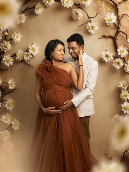 An intimate couple's portrait framed by our floral arch. The Copper gown's warm tone is perfect for romantic and timeless photos.
