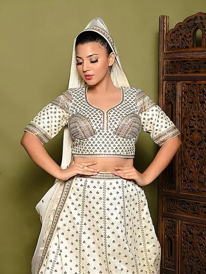 A traditional pose with the dupatta over the head, creating a classic and modest look. This shows my versatility in capturing different styles within ethnic fashion.