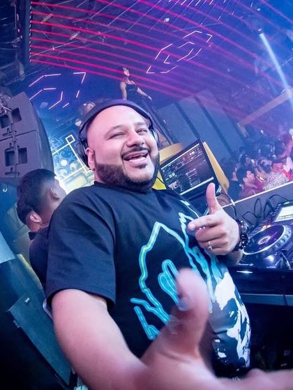 A thumbs-up from the DJ booth. This was a phenomenal night in Kolkata, and the happy faces in the crowd tell the whole story.