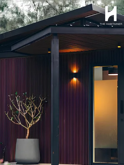 The entrance to a modern home, featuring dark fluted cladding and warm exterior lighting. This detail shot highlights the premium finishes and thoughtful design touches that define my work.
