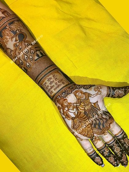 Celebrating a love as timeless as Radha and Krishna. I truly enjoy bringing these divine figures to life in my mehendi, surrounded by graceful peacocks and palace scenery.