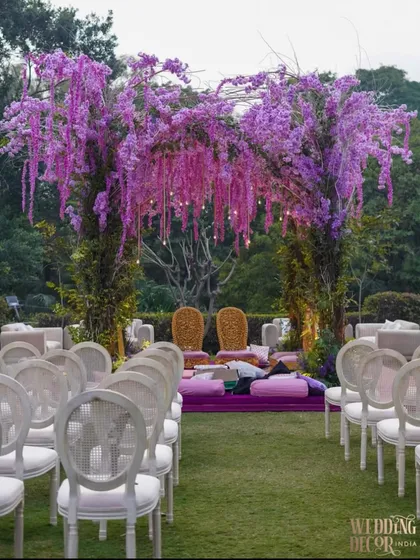 An outdoor mandap that is both bold and romantic. We used cascading lavender and purple wisteria to create a stunning floral canopy, bringing a ‘Lavender Dream’ to life against a natural garden backdrop.