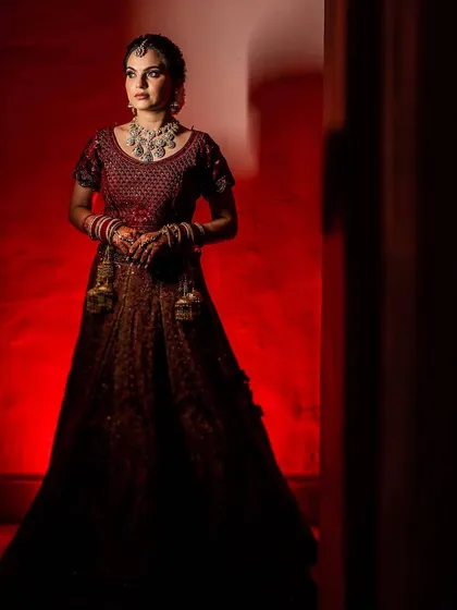Shubhangi's wedding photos. I created a soft, romantic look with a messy braided bun and flawless makeup that lasted all night.