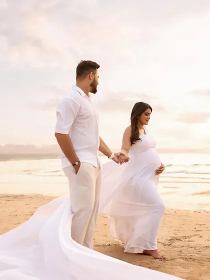Walking hand-in-hand towards their future. The flowing white gown and the peaceful beach setting make this a hopeful and beautiful portrait.