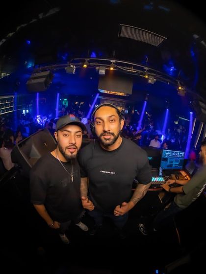 A fisheye lens shot with my fellow DJ from the console, capturing the entire club atmosphere in one frame.