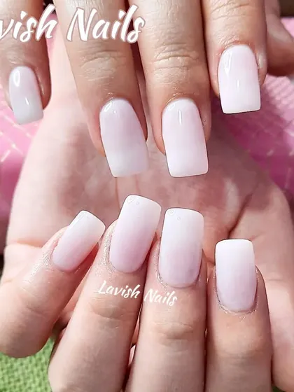 A simple and clean set of milky white square nails.