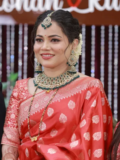 Unedited DSLR click of my bride Ruchira. Her reception look in a red Banarasi saree with a beautiful gajra bun is timeless.