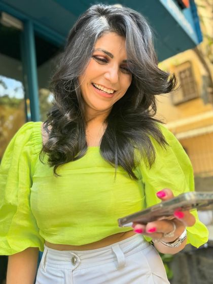 I love working with natural hair, including beautiful greys. For this client, I created a layered shag haircut that adds volume and movement, beautifully framing her natural silver streak.