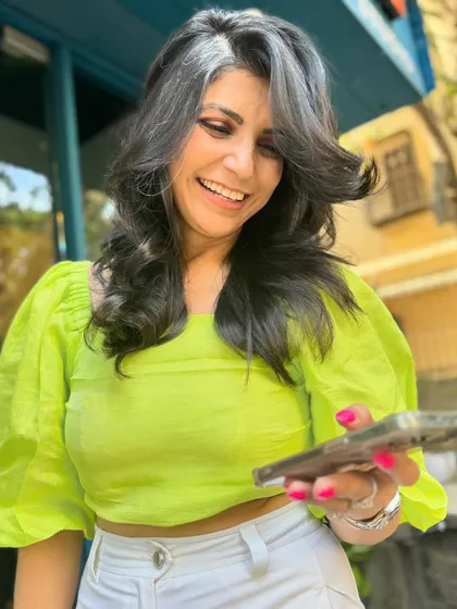 I love working with natural hair, including beautiful greys. For this client, I created a layered shag haircut that adds volume and movement, beautifully framing her natural silver streak.