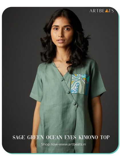 The Sage Green Ocean Eyes Kimono Top. The pocket on this linen top features a small piece of my intricate, hand-drawn art, adding a unique detail to a simple, elegant piece.