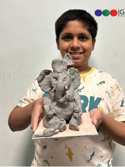 Look at the focus and pride on this young boy's face. Each student leaves our workshop with their own handmade, eco-friendly Ganpati.