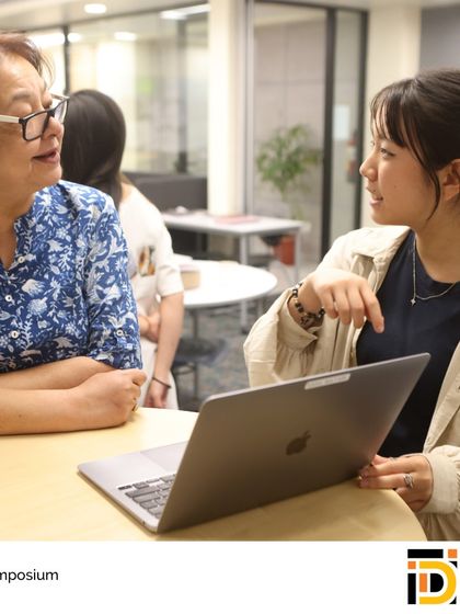 A student presents her IDI project on a laptop, demonstrating her digital design and research skills. Our guidance counselors highlight these unique capstone experiences in college applications.