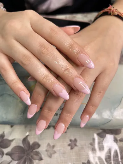 A classic pink French manicure with a heart accent nail. This clean and elegant work was done by one of my students, proving that mastering the basics is key.