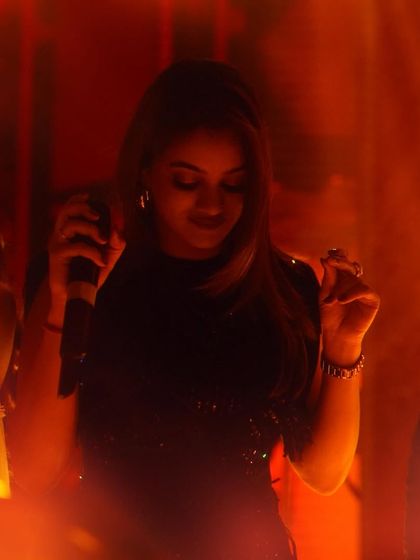 In my element during a show in Ahmedabad. The warm stage lights and the energy from the crowd create a perfect, intimate vibe even in a large venue.