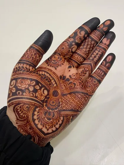 A close-up of a beautiful, dark henna stain, showing how the fine lines and details have developed into a rich color.
