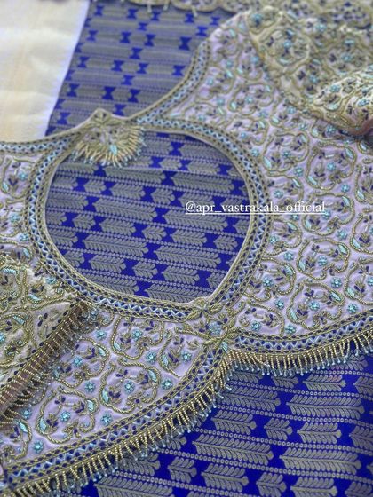 A lavender blouse with a sheer back and all-over zardosi work.