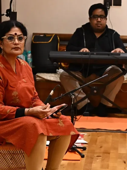 In discussion with music director Anirudh Varma during a rehearsal for 'Songs of the Millstone'. The music is a critical element, weaving together folk melodies and classical structures to support the narrative.