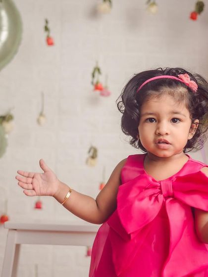 Turning two is a big deal. We love this theme with hanging roses and balloons, and we have plenty of tricks to get even the busiest toddlers to pause for a perfect shot.