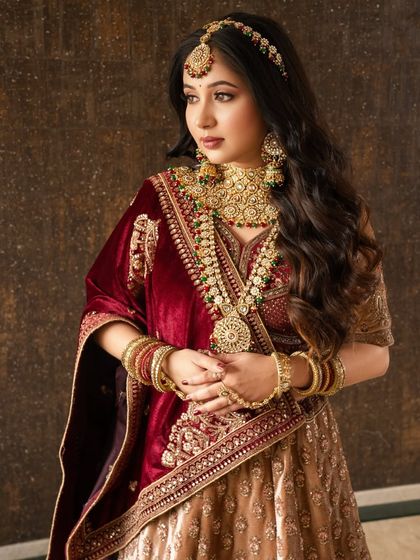 A bride wrapped in stories. This look is soft, distant, and dreamy, with makeup that enhances her features without overpowering her natural beauty.