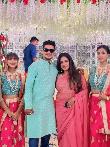 Our team of professional dancers is ready to make your entry grand. Here we are, posing with the happy couple and our dancers in coordinated outfits before the start of the event.