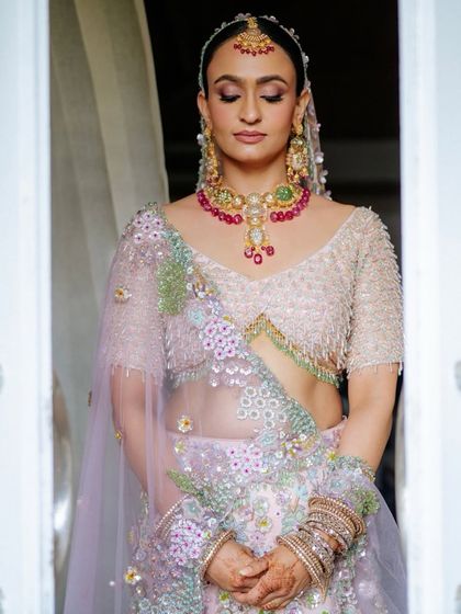 A moment of calm before the ceremony. Tithi's dewy, glowing skin is the result of a great skincare routine and our light-handed makeup application.