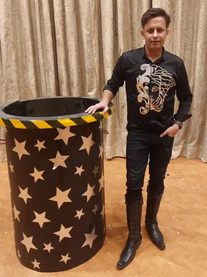 Posing with one of my props before a show for the Ministry of Home Affairs Family Day. Even a simple prop can be part of a grand illusion that brings joy and wonder to the audience.
