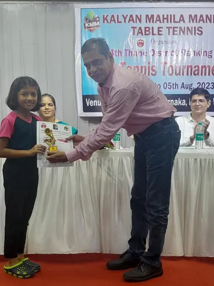 Young champion Kshiti Sawant receives her trophy for winning a bronze medal in the U-11 category at the 4th District Ranking tournament. We ensure a formal prize distribution ceremony to honor winners.