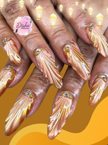 Golden glam with a touch of royalty. A closer look at the stunning 3D golden wing design, featuring a metallic chrome finish and jewel accents.