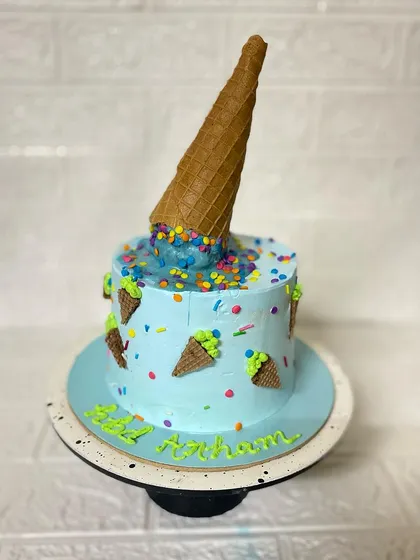 A full view of the playful and delicious-looking ice cream cone cake.