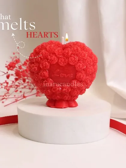 A light that melts hearts. This beautiful red heart-shaped candle with intricate rose details is another one of our special creations for Valentine's Day.