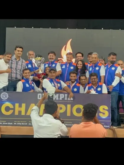 Our founder, Mangirish Palekar, with the Olympia InterClub Badminton Championship trophy won for PJ Hindu Gymkhana. Leading by example is a core part of our philosophy.