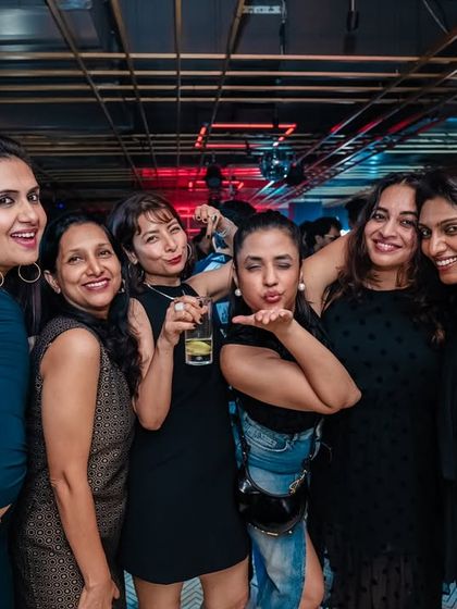 A group of friends having a great time at my Bollywood night. It's all about creating a space for people to celebrate together.