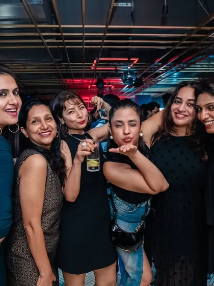 A group of friends having a great time at my Bollywood night. It's all about creating a space for people to celebrate together.