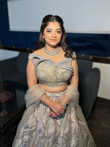 Jaya, looking poised and elegant. This is a perfect example of creating timeless beauty with a touch of modern glam.