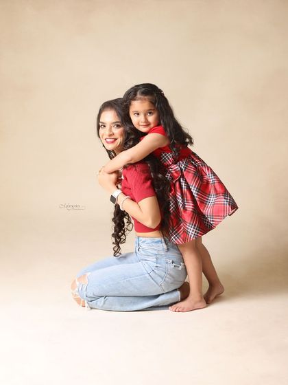 A playful piggyback hug. These are the real, fun moments that make for the best family photos.