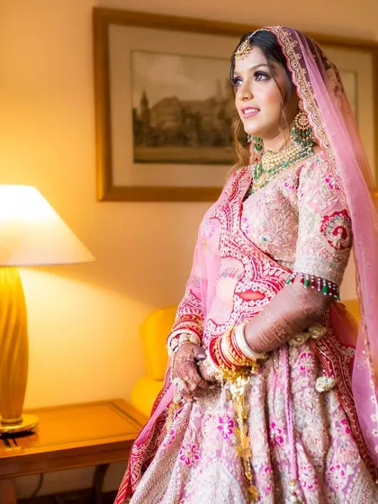 Another beautiful shot of Shikha on her wedding day. Her makeup is perfectly balanced, with soft eyes and a natural lip, letting her bridal glow shine through.