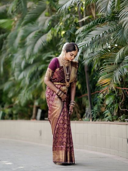 A full-length view of Shloka's breathtaking bridal attire. The makeup was designed to be long-lasting and photograph beautifully, ensuring she looked flawless from every angle throughout her wedding day.