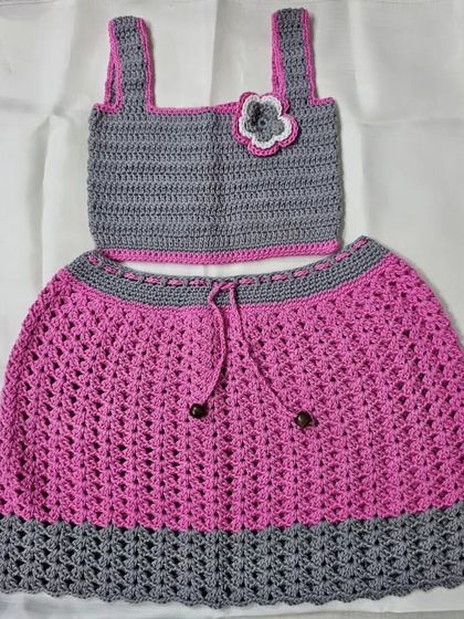 This is a full view of the 'Lil Pink Coord Set' I made for a child. It includes a grey crop top with pink trim and a matching pink and grey skirt.