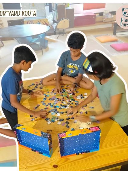 Three children work together on a large floor puzzle during a Jigsaw Jam. Our events are designed to be inclusive and fun for the whole family.
