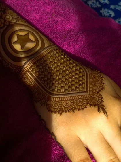 For the ultimate Marvel fan! This bride wanted Captain America's shield incorporated into her henna, and I was so excited to create this custom design.