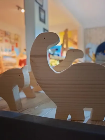 A duplicate of 135, a close-up of the wooden dinosaur and horse cutouts from our DIY kits. They are made from smooth, solid pine wood, perfect for painting.
