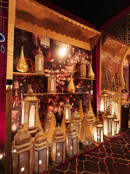 The lamp market stall, designed to look like a shop in a souk. The warm light from the lanterns created an inviting and enchanting atmosphere.