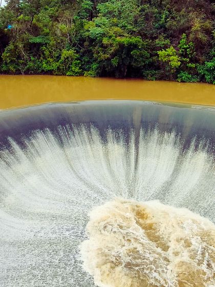 The unique sight of a 'well' spillway at a dam in Coorg during the monsoon. Nature's power and beauty on full display.
