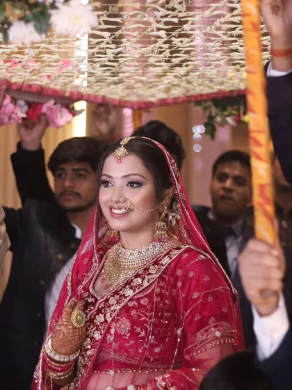 The bridal entry is a moment of pure grace. I captured this bride's serene smile as she walked under the phoolon ki chadar.