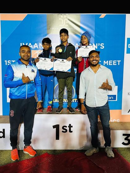 In the spotlight, celebrating a victory with pride on the TrackNights podium.