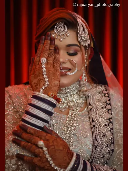 A bride's shy smile holds so much emotion. This close-up portrait from a Muslim wedding focuses on the intricate details of her jewelry and the delicate expression just before the main event. My goal is to capture that quiet beauty.