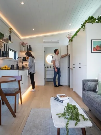 A couple enjoying their compact and stylish modular home. This image captures the essence of the lifestyle we offer: modern, comfortable, and connected to nature.