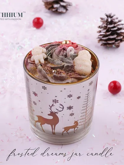 The 'Frosted Dreams' jar candle with a reindeer motif.