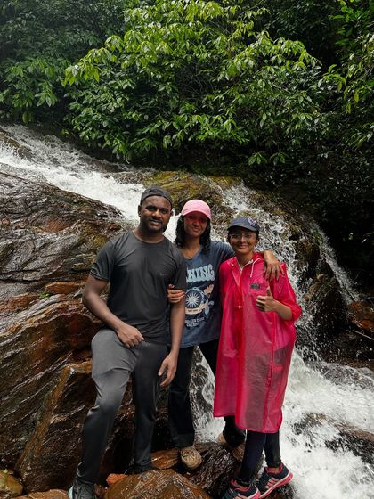 Friends posing by a small waterfall on the Kodachadri trail.