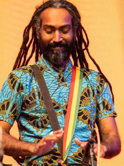 Here I am, lost in the rhythm during a performance with the Taal Inc. Rhythm Ensemble. While facilitation is different from performance, a deep love for playing is at the heart of it all.